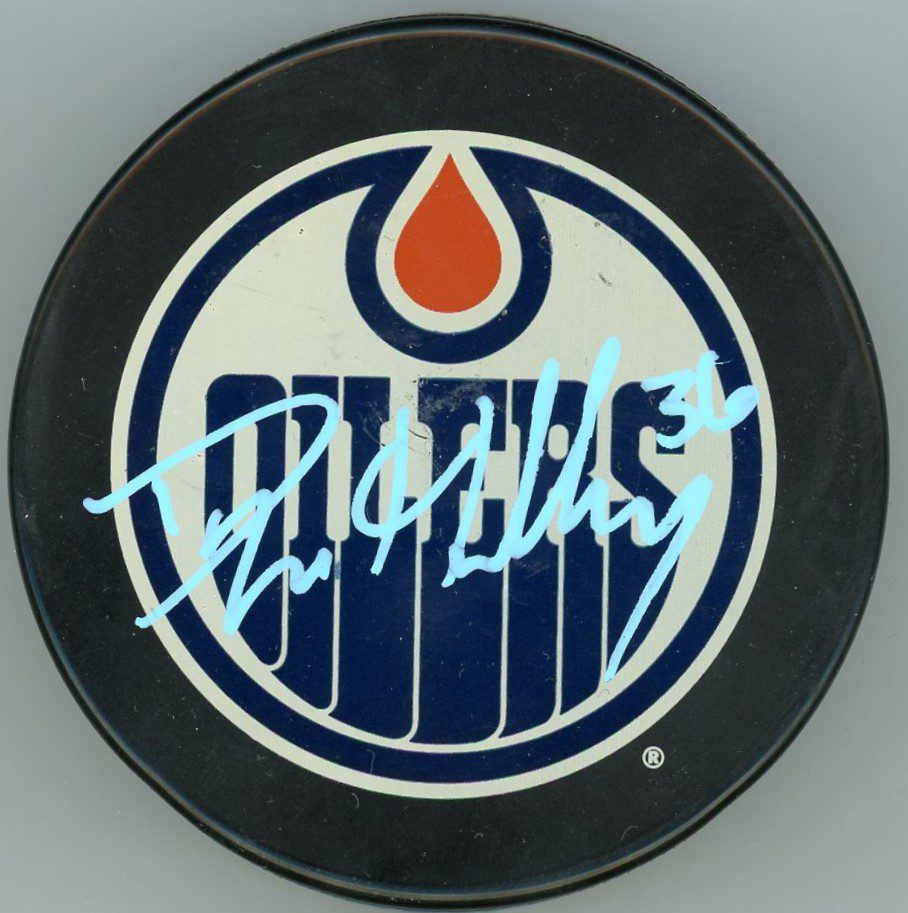 Dylan Holloway Edmonton Oilers Signed Puck w/COA | Icons and Heroes